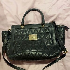 Micheal Kors purse. Good size bag, comes with strap.